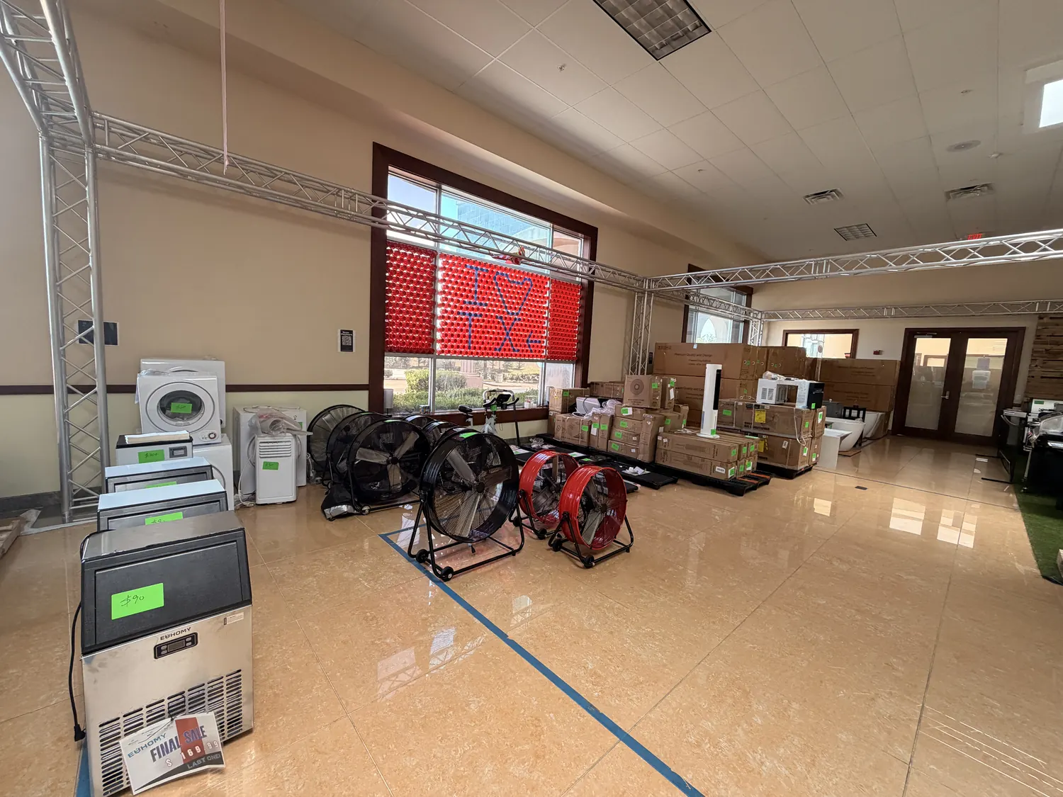 Chest freezers, ice maker and portable air conditioner price-tagged on the sale floor