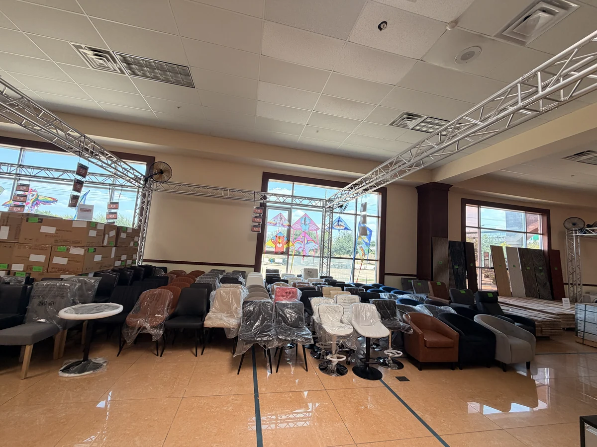 Sofas, armchairs and side tables set out on the sale floor