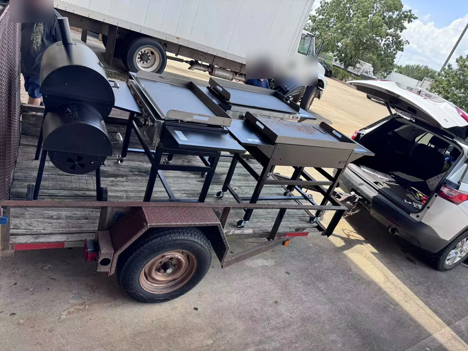 Trailer loaded with griddles and smokers leaving the Cube-Age Houston warehouse