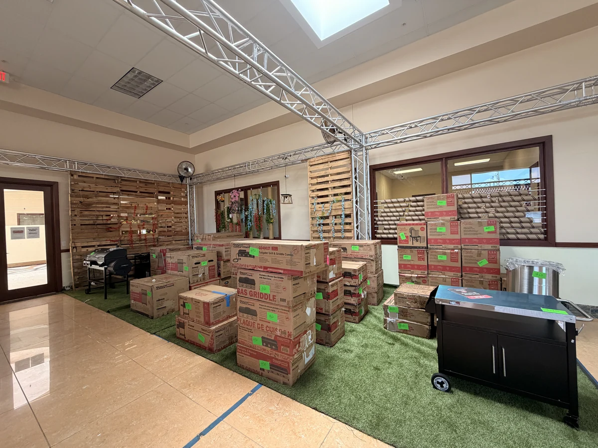 The restocked BBQ corner of the Cube-Age Houston sale floor, grills and griddles still in the original boxes