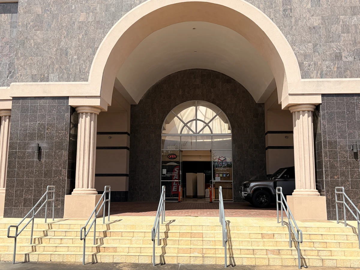 Main entrance of the Cube-Age building at 9500 W Sam Houston Pkwy S, Houston