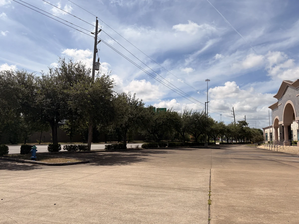 Wide view of the free parking lot beside the Cube-Age building
