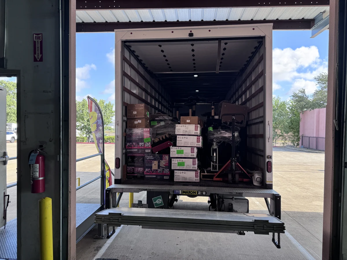 A truck backed up to the loading dock with the order already loaded