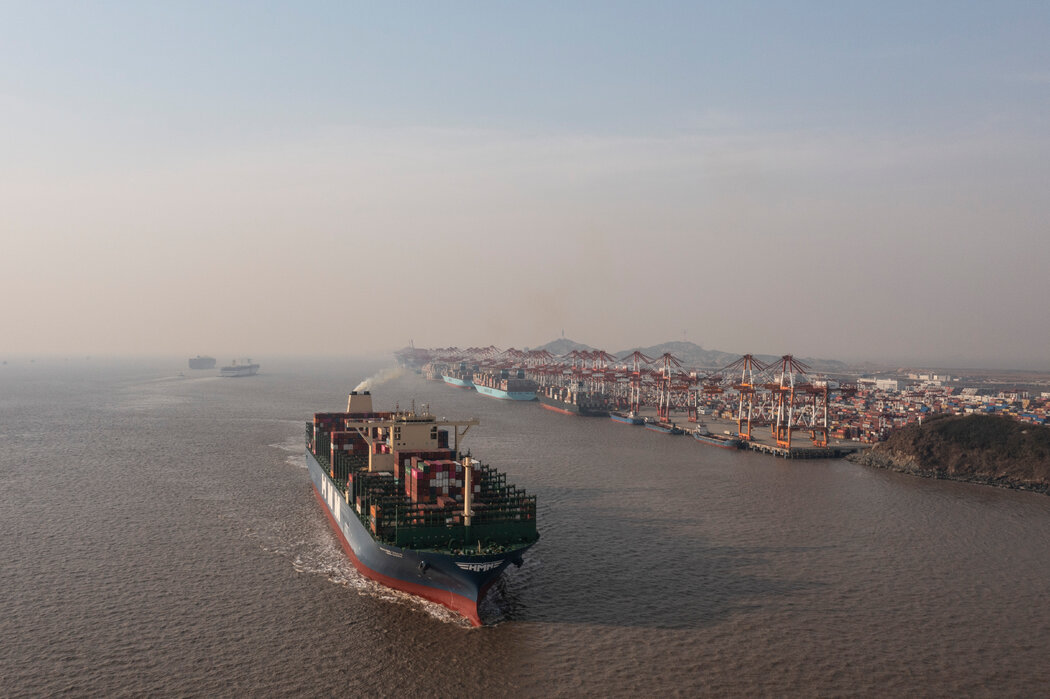 China port — container vessel departing wharf