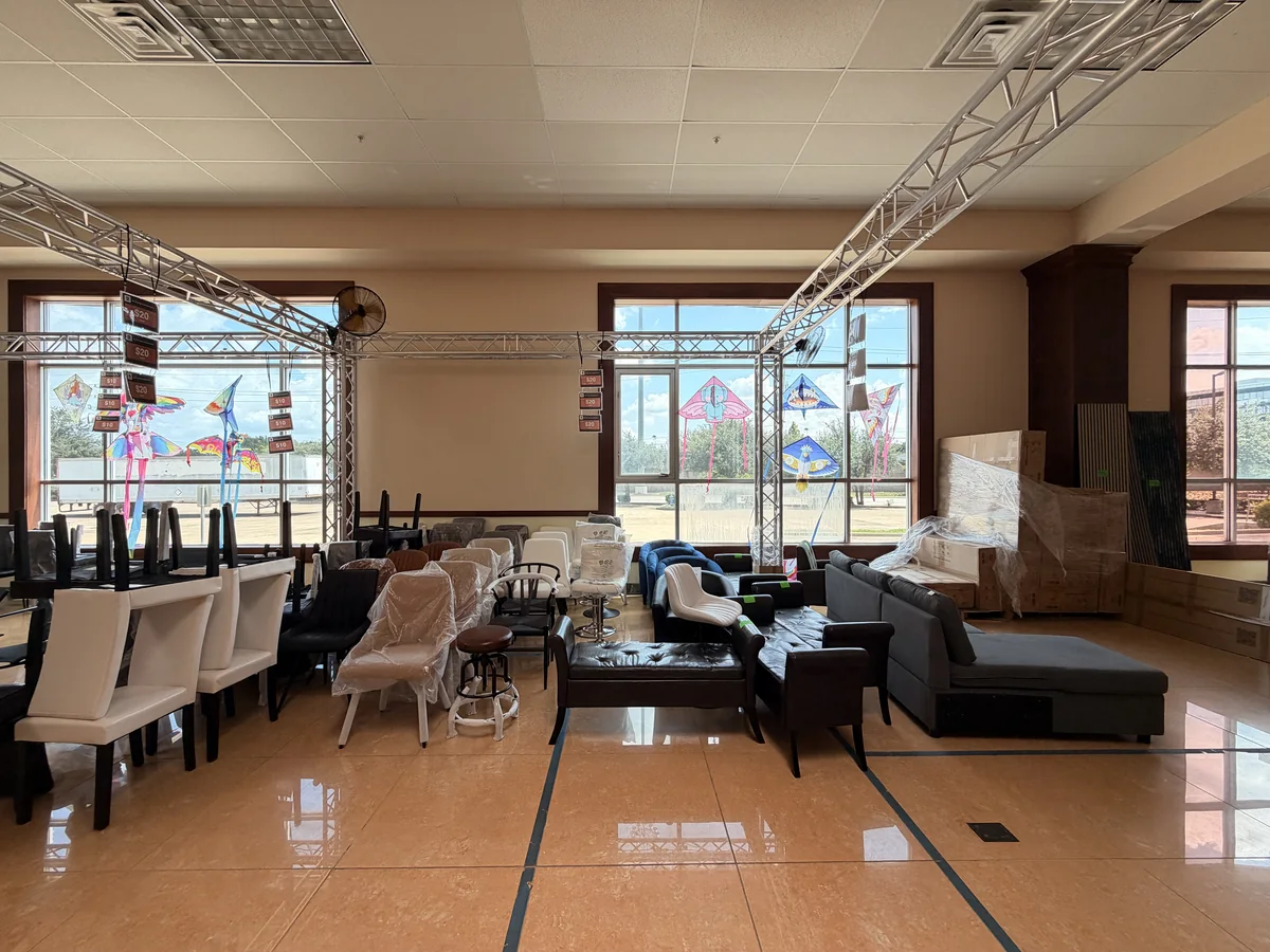 Remaining chairs and sofas pushed together after the Cube-Age pop-up sale closed