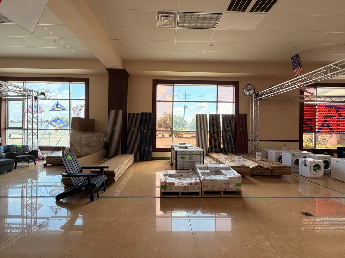 Wall panels and tile left on the floor after the Cube-Age pop-up sale closed