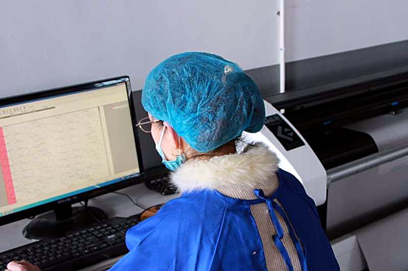 A kite design workstation at the factory, with artwork laid out on screen before printing