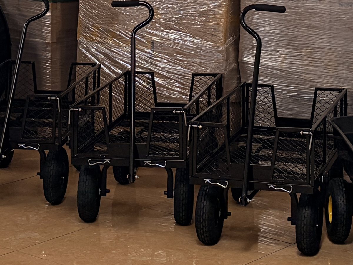Mesh steel garden carts lined up on our Houston warehouse floor