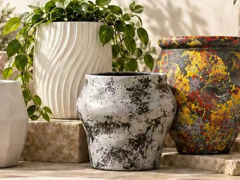 Magnesium oxide planters grouped on a stone terrace