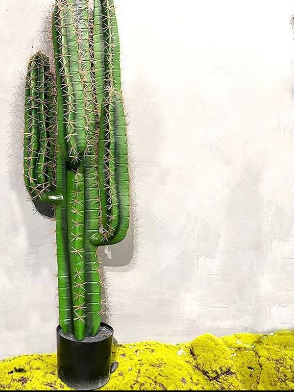 A tall artificial columnar cactus in a pot