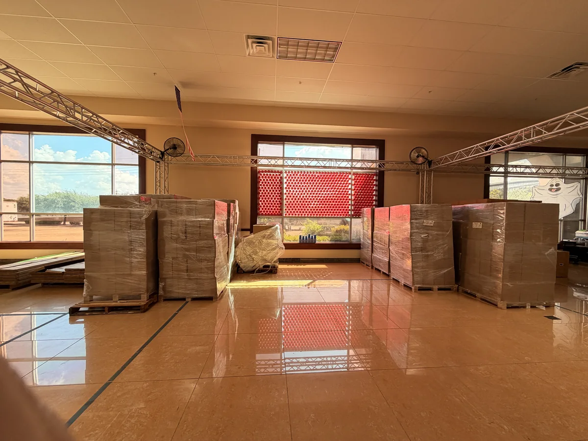 Wrapped pallets of stock waiting to be placed in the Cube-Age showroom